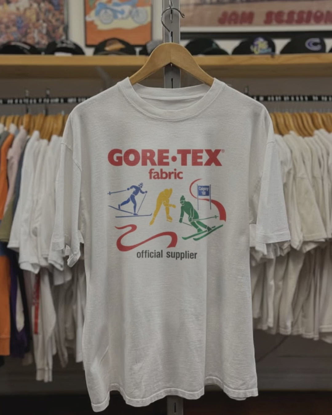 88 Calgary Goretex Official Supplier Washed White Tee product video [GB-DPA:d7526a651401]